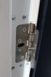 Close-up of fire door showing compliant seals and hinges.